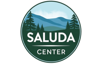 Saluda Center Featured Image Circular logo for Saluda Center featuring a forest and mountain landscape in blue and green tones with the word SALUDA CENTER in white.