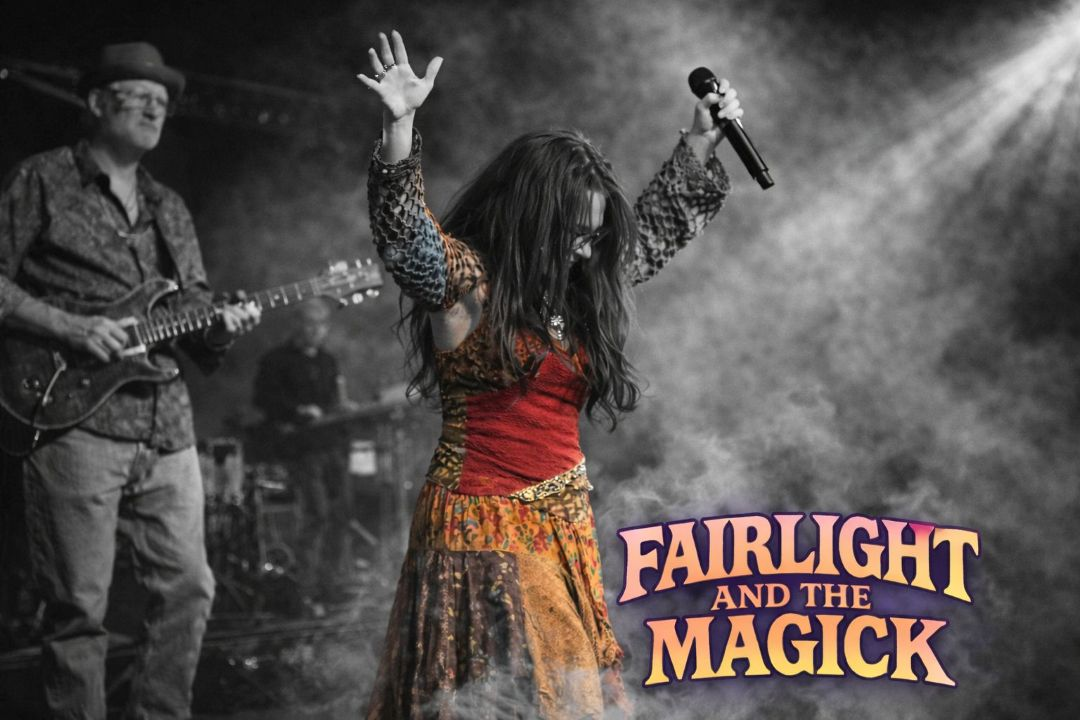 Female singer on stage raising her hands, wearing a red top and patterned skirt, with a guitarist in the background; the band name 'Fairlight and the Magick' appears in pink lettering at the bottom right.